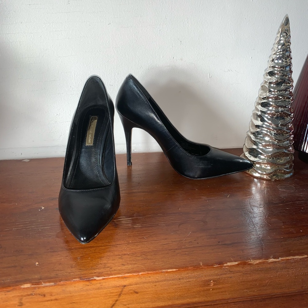 Black leather pointed toe pumps